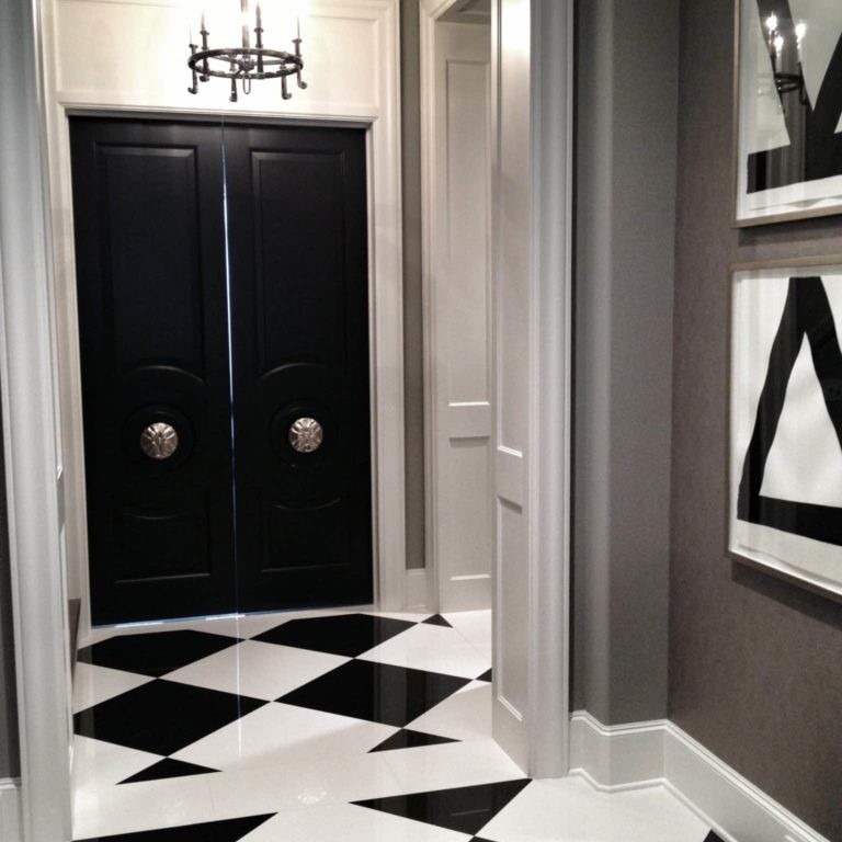 Luxury entryway with black doors