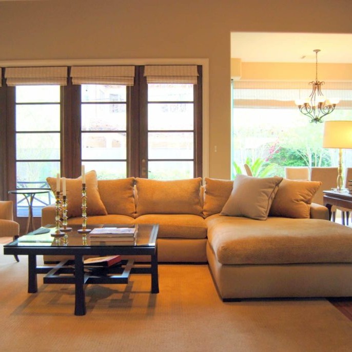 Family room interior design with glass coffee table