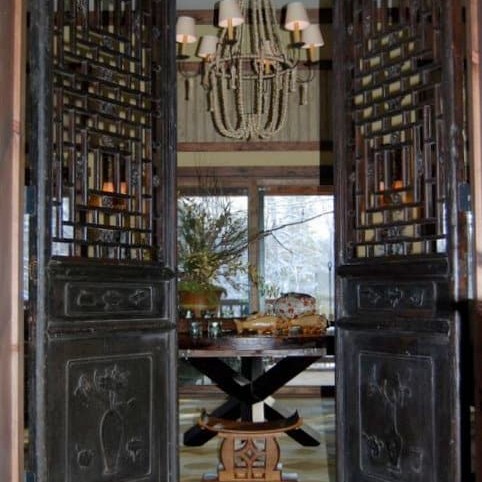 Luxury entryway with black doors