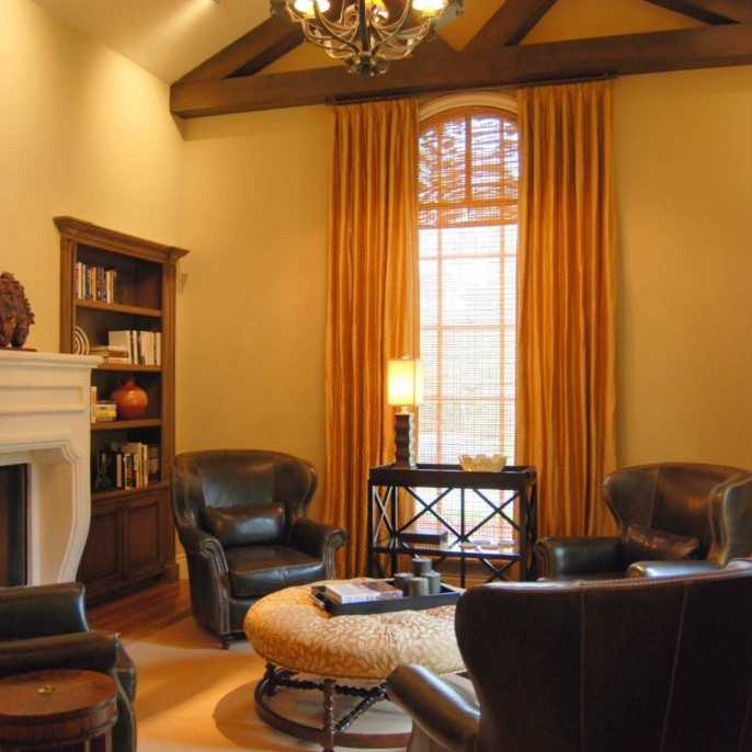 Family room interior design with dark leather armchairs