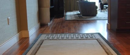 Hallway interior design with a geometric area rug