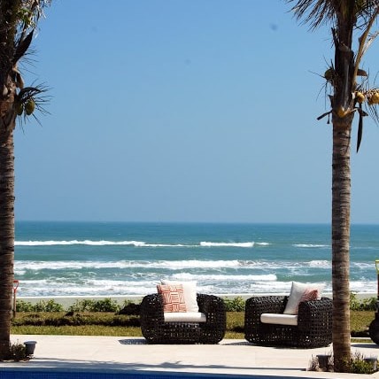 Ocean-side in-ground pool with seating