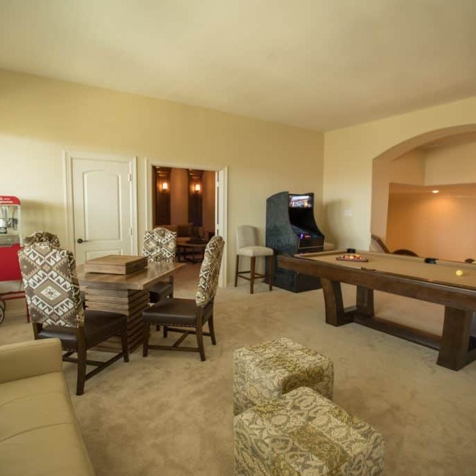 Game room interior design with popcorn machine and pool table