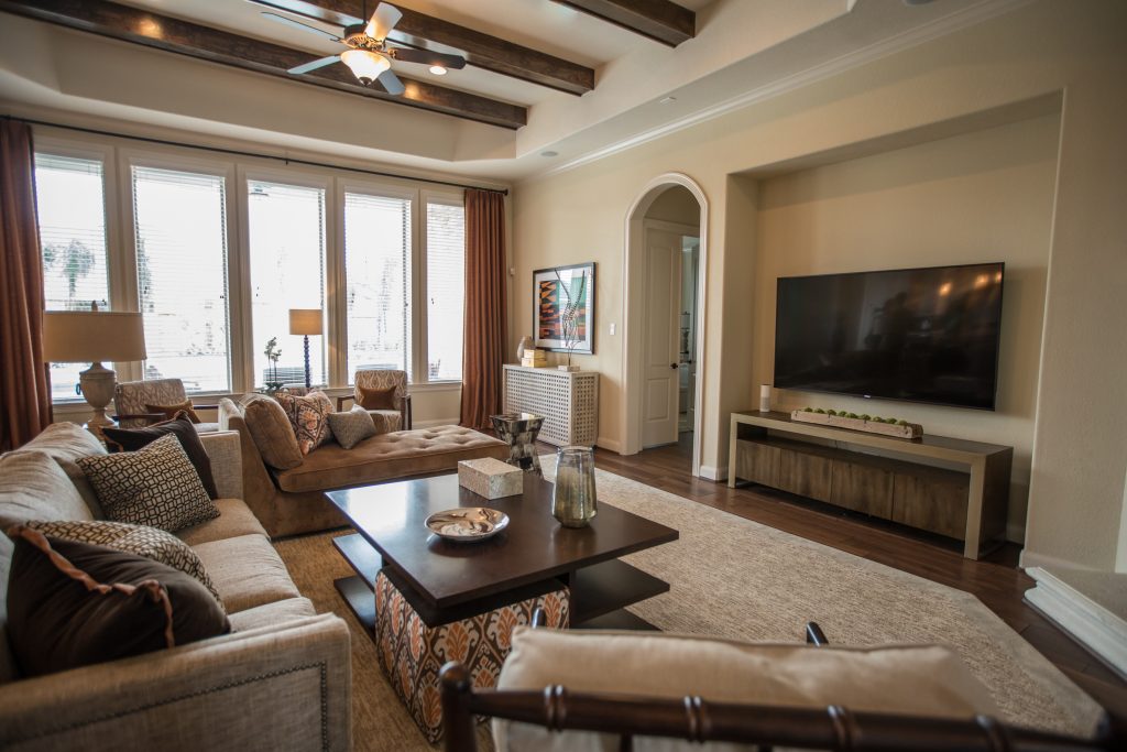 Beige and orange living room design with flatscreen TV