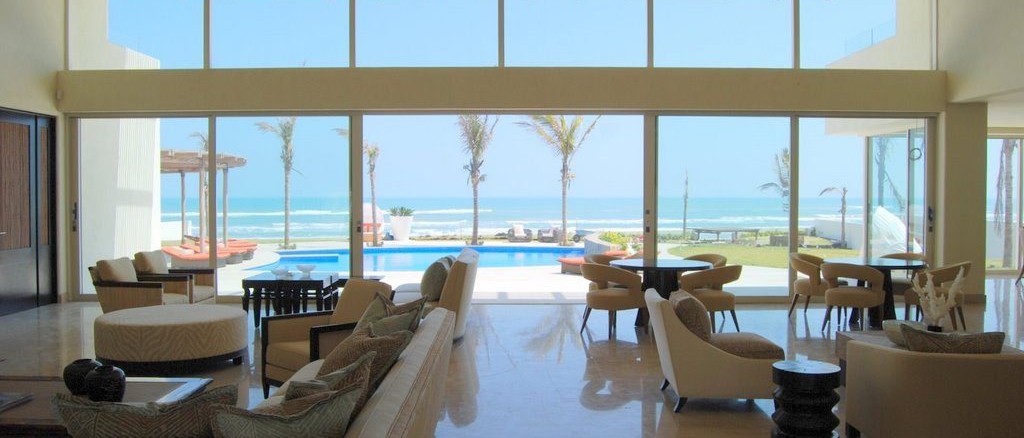 Beautiful seating area with a large in-ground pool in the background