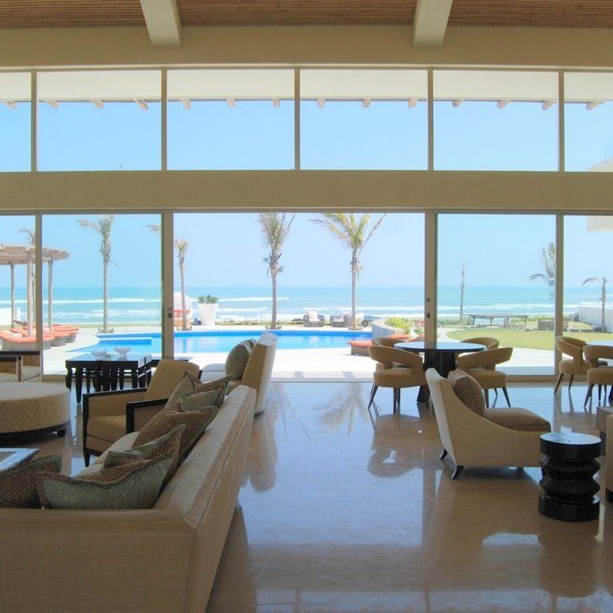 Beautiful seating area with a large in-ground pool in the background