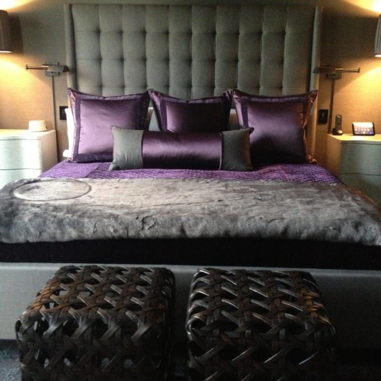 Gray and purple bedding with satin and faux fur textures