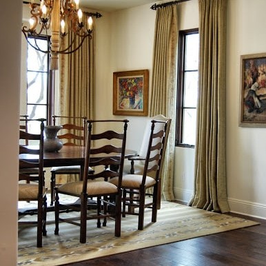 Cream dining room interior design with dark wood furniture