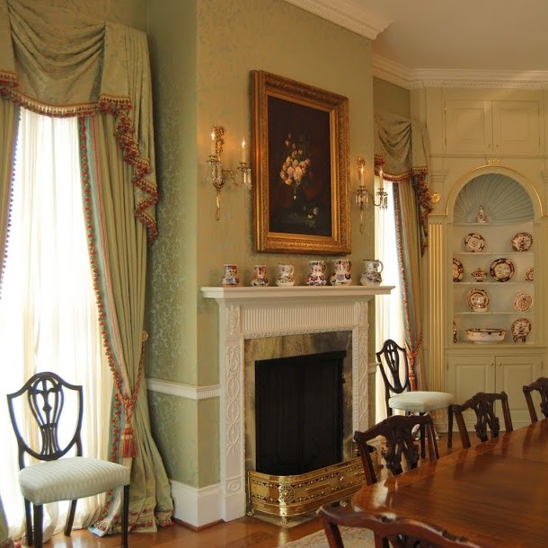 Traditional dining room interior design with mint green walls and curtains