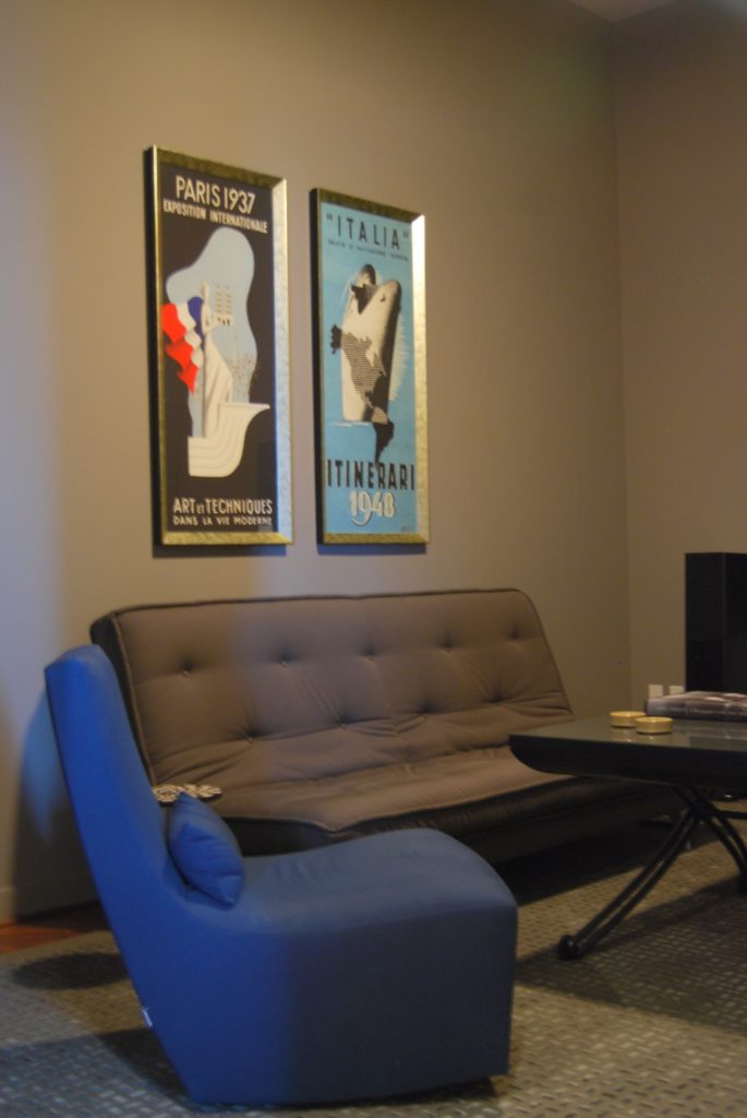 Bedroom interior design with gray futon and blue chair