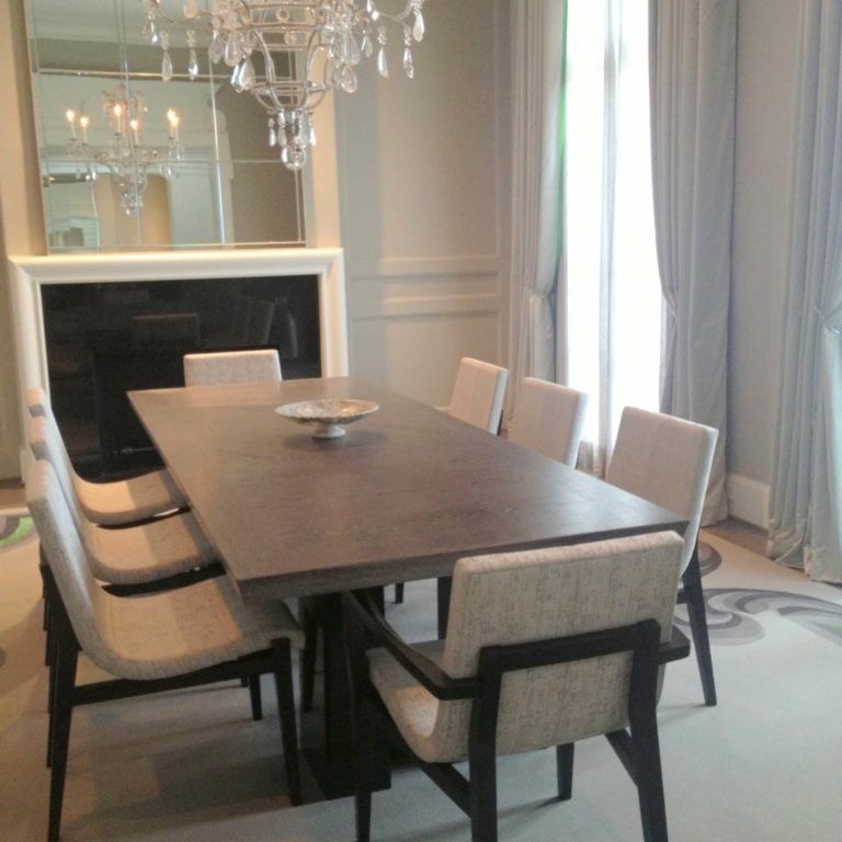 Light-toned dining room interior design with crystal chandelier