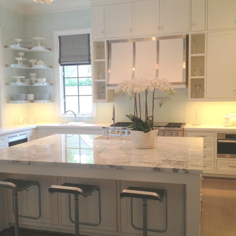 White kitchen design with light gray marble island