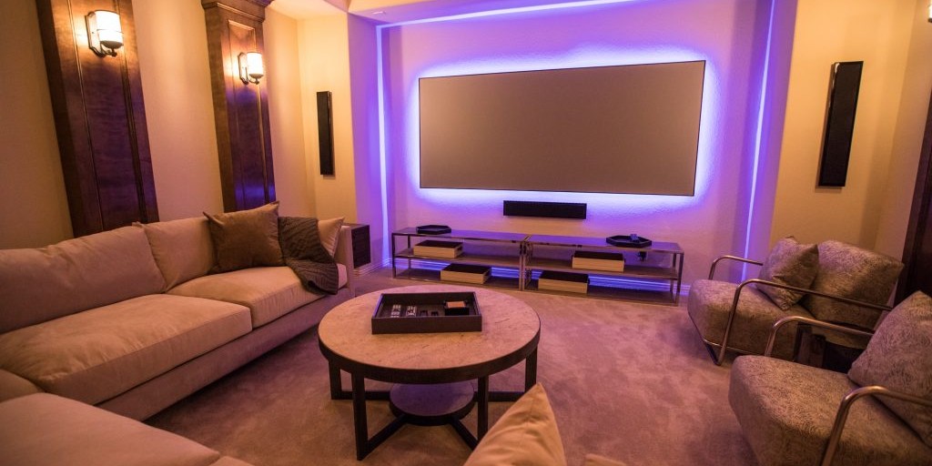 Media room interior design with purple backlit television