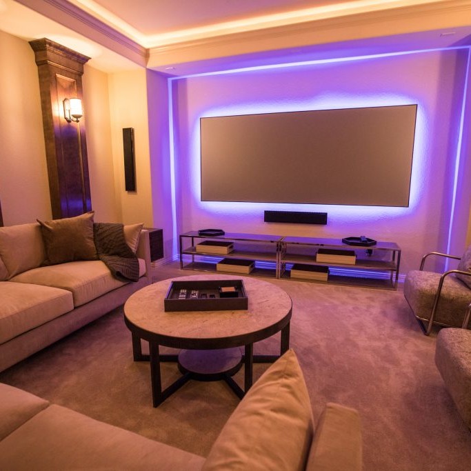 Media room interior design with purple backlit television