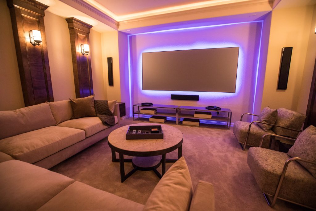 Media room interior design with purple backlit television