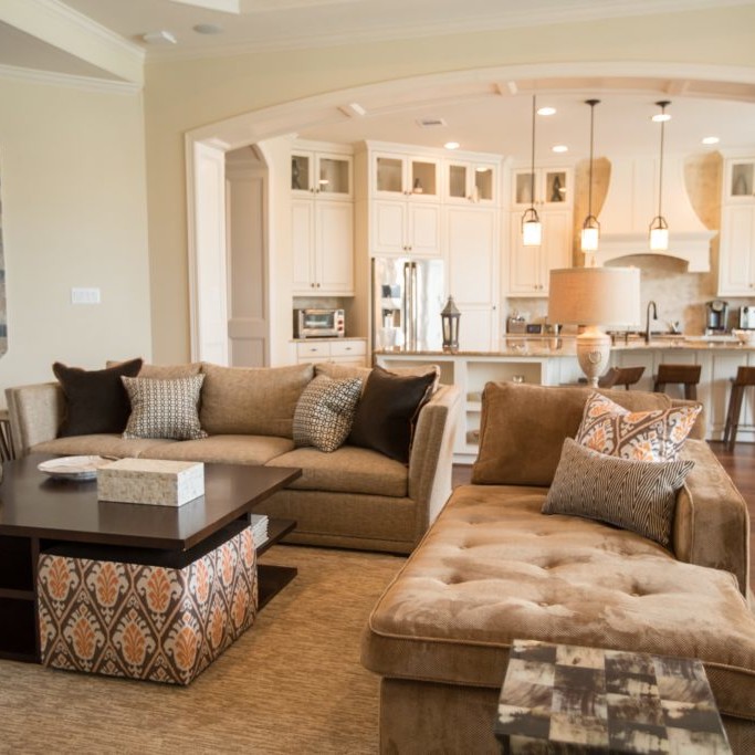 Beige and white living room and kitchen design in Richmond, VA