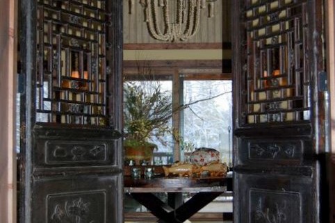 Ornate entryway doors of a beautiful lake house