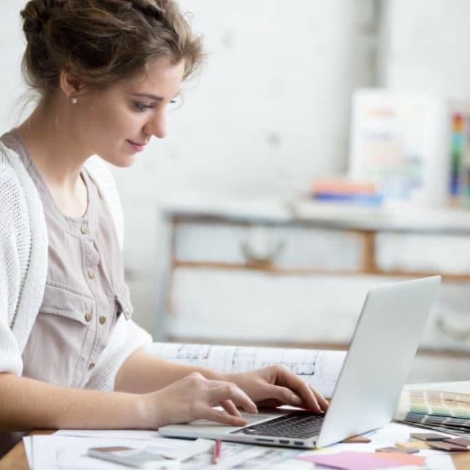 Woman working in a messy home office