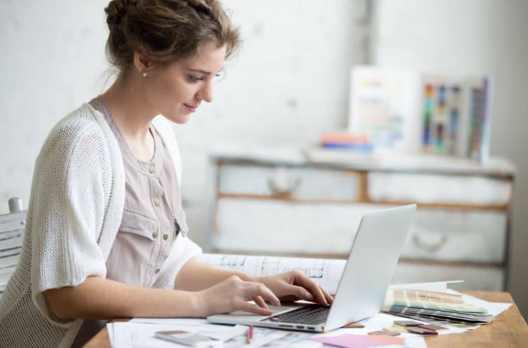 Woman working in a messy home office