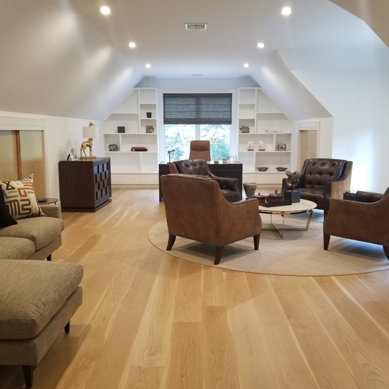 Cream colored attic space interior design in Hamptons, NY