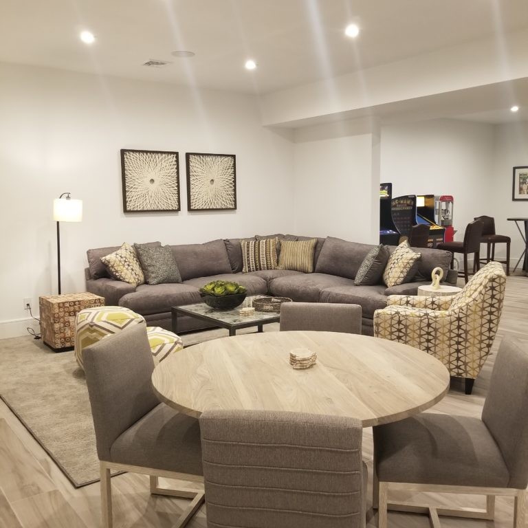 Neutral-toned living and dining area interior design in Hamptons, NY