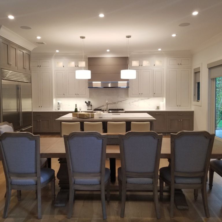 Neutral-toned dining room and kitchen design in Hamptons, NY