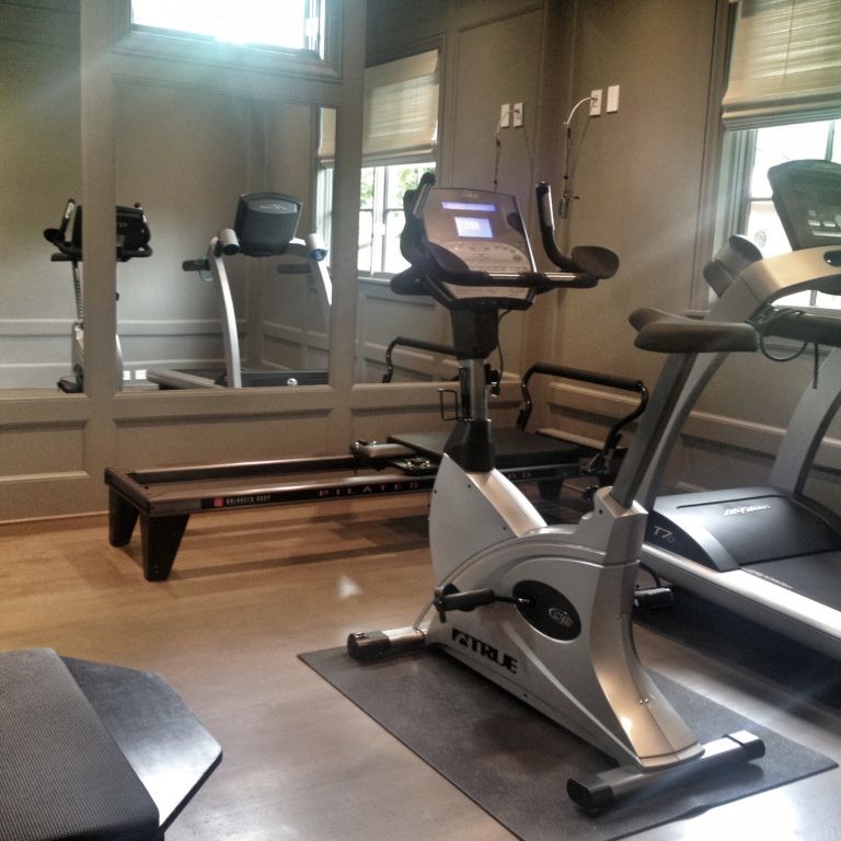 Home gym interior design with exercise bike and treadmill