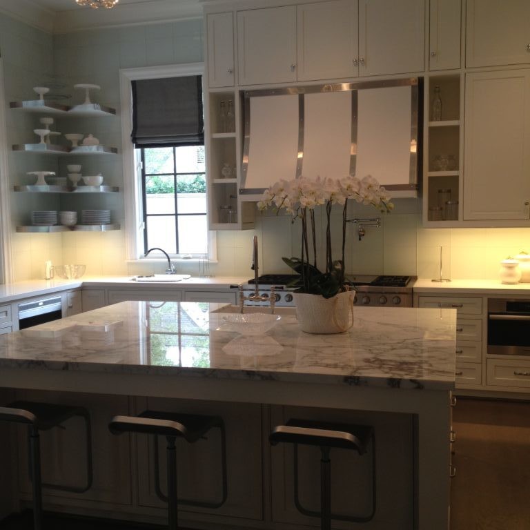 White kitchen interior design with Italian Carrera marble countertops